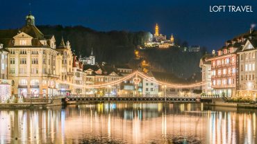 ทัวร์ลูเซิร์น Lucerne, Switzerland ชมบรรยากาศยามเช้าของเมืองที่มีสะพานชาเปล สะพานไม้ทอดตัวข้ามแม่น้ำรอยส์ ในอดีตสร้างมาตั้งแต่ศตวรรษที่ 14 ถือได้ว่าเป็นสะพานไม้ที่เก่าแก่ที่สุดแห่งหนึ่งของยุโรป ด้านหลังมีวิวของยอดเขาพิลาตุส เป็นฉากหลัง โดดเด่นเหนือทะเลสาบสีฟ้า